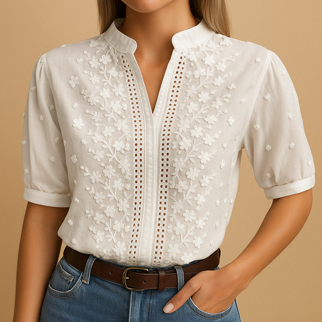 Elegant white blouse for women with a classic collar and button closure, perfect for work or casual occasions.