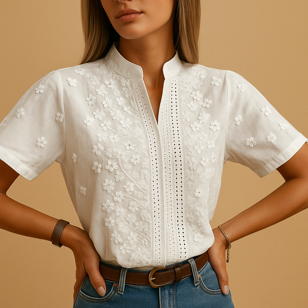 Elegant white blouse for women with a classic collar and button closure, perfect for work or casual occasions.