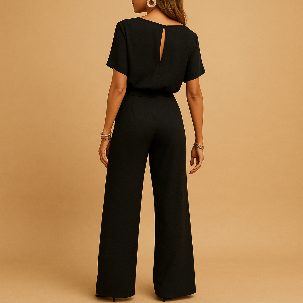 Woman wearing an elegant formal jumpsuit with a tailored fit and flowing sleeves, suitable for galas, weddings, and stylish evening occasions.