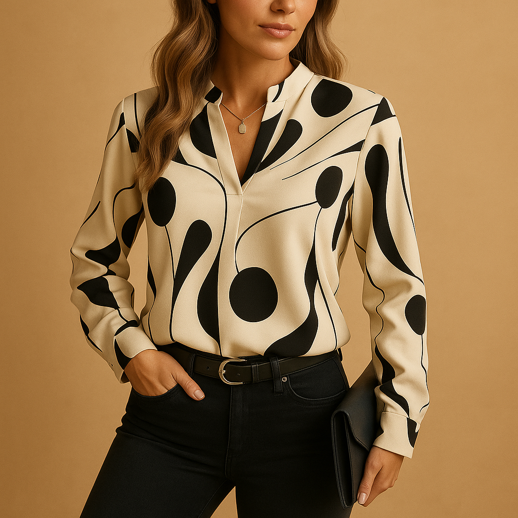 Women’s elegant printed blouse with a smooth fit and refined design, ideal for casual or formal everyday outfits.