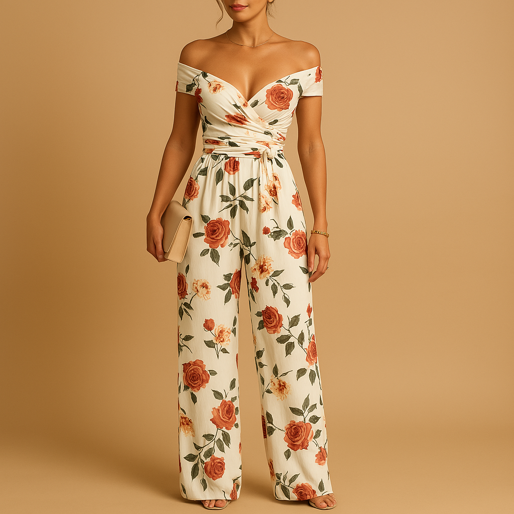 Woman wearing an off-shoulder floral jumpsuit with a tailored silhouette and blue-red print, ideal for weddings, ceremonies, and summer events.