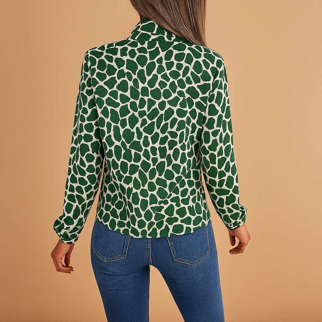 Women’s green polka dot blouse with tie detail and elastic cuffs, perfect for work outfits and stylish everyday wear.