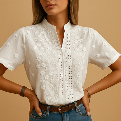 Elegant white blouse for women with a classic collar and button closure, perfect for work or casual occasions.
