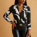 Women’s black and white printed blouse with a lightly tailored fit and classic design, ideal for daily wear and formal occasions.