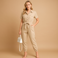 Woman wearing a tailored cargo jumpsuit with a V-neckline and cargo pockets, suitable for casual or chic occasions.