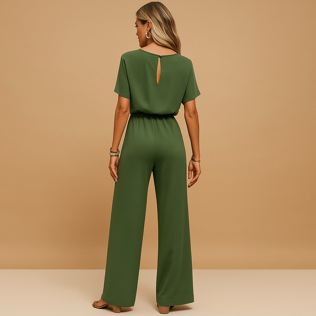 Woman wearing an elegant formal jumpsuit with a tailored fit and flowing sleeves, suitable for galas, weddings, and stylish evening occasions.