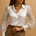 Women’s blouse with lace sleeves and a classic collar, suitable for work and formal outfits.