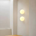 Flush Mount Globe Wall Sconce with Frosted Glass Shade and Minimalist Design - Image 1