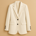 Long women’s blazer with a timeless silhouette and modern details in classic neutral tones, perfect for formal and casual outfits.
