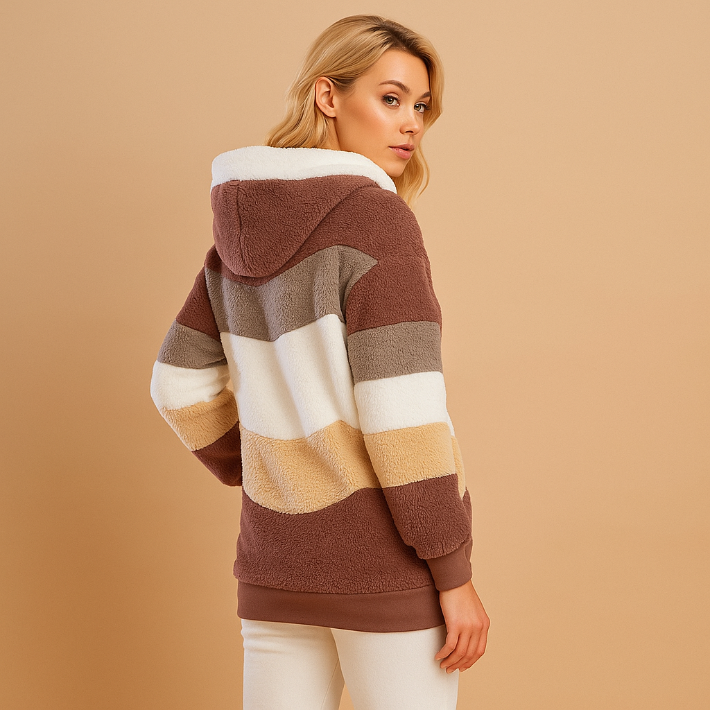Women’s long plush winter coat with relaxed fit and soft warm fabric, ideal for cold weather and elegant winter outfits.