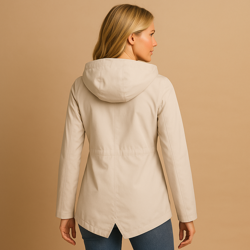 Women’s long waterproof raincoat with hood, breathable fabric, and lightweight design for stylish everyday rain protection.