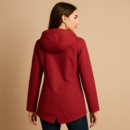 Women’s long waterproof raincoat with hood, breathable fabric, and lightweight design for stylish everyday rain protection.