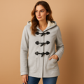 Woman wearing a long winter coat with hood and wind-resistant design, ideal for warm, stylish protection during cold weather.