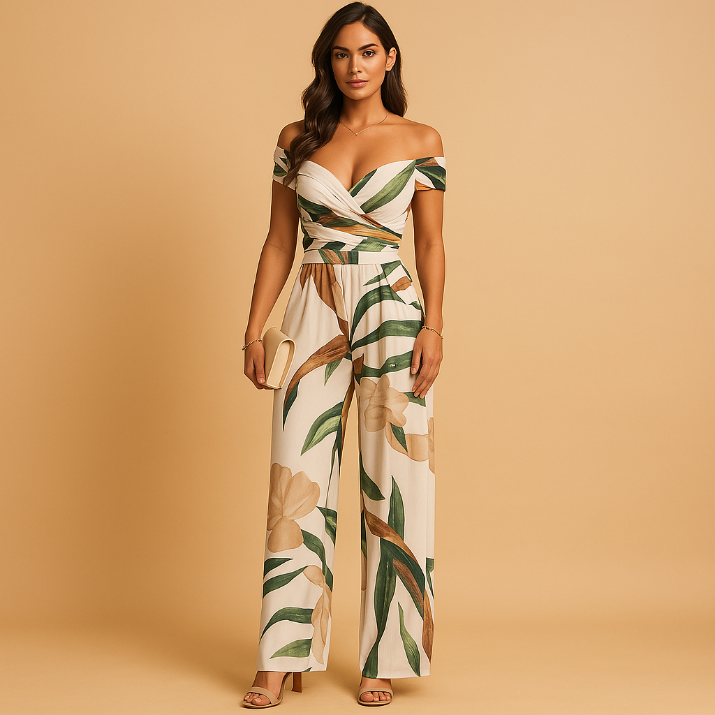 Woman wearing an off-shoulder floral jumpsuit with a tailored silhouette and blue-red print, ideal for weddings, ceremonies, and summer events.