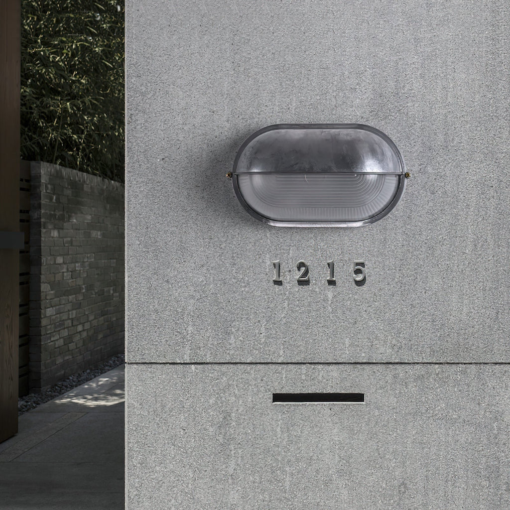 Outdoor Bulkhead Wall Light with Oval Design and Ribbed Glass Diffuser - Image 9