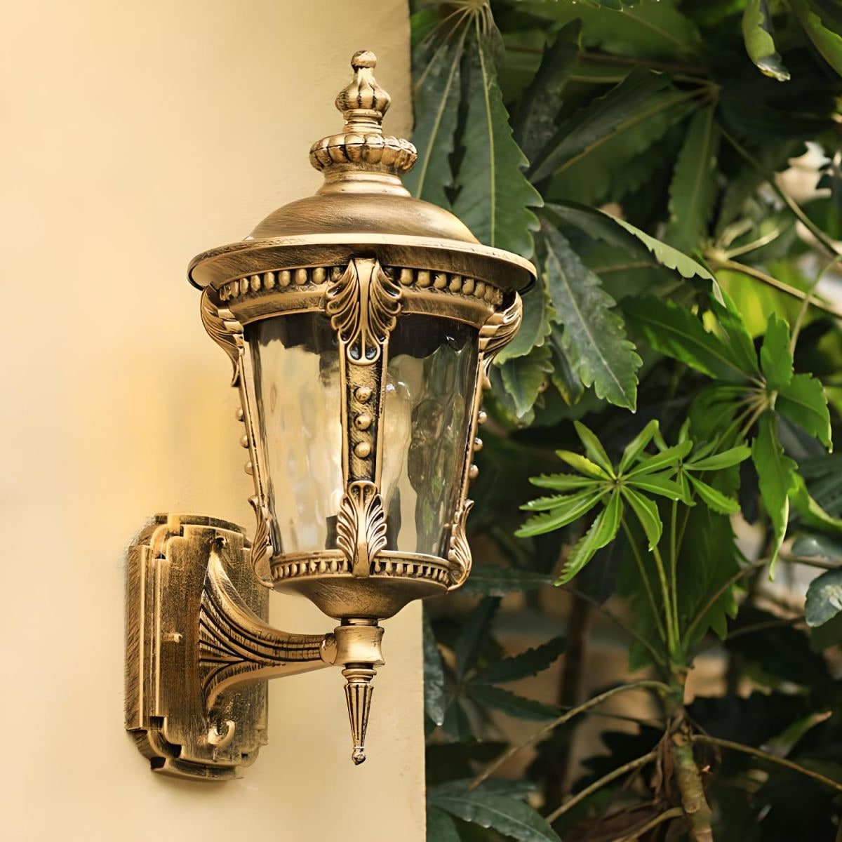 Outdoor Wall Sconce with Antique Brass Finish and Decorative Glass Shade - Image 1