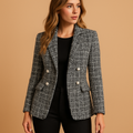 Women’s plaid tailored blazer with a fitted silhouette and timeless check pattern, perfect for work and chic casual looks.