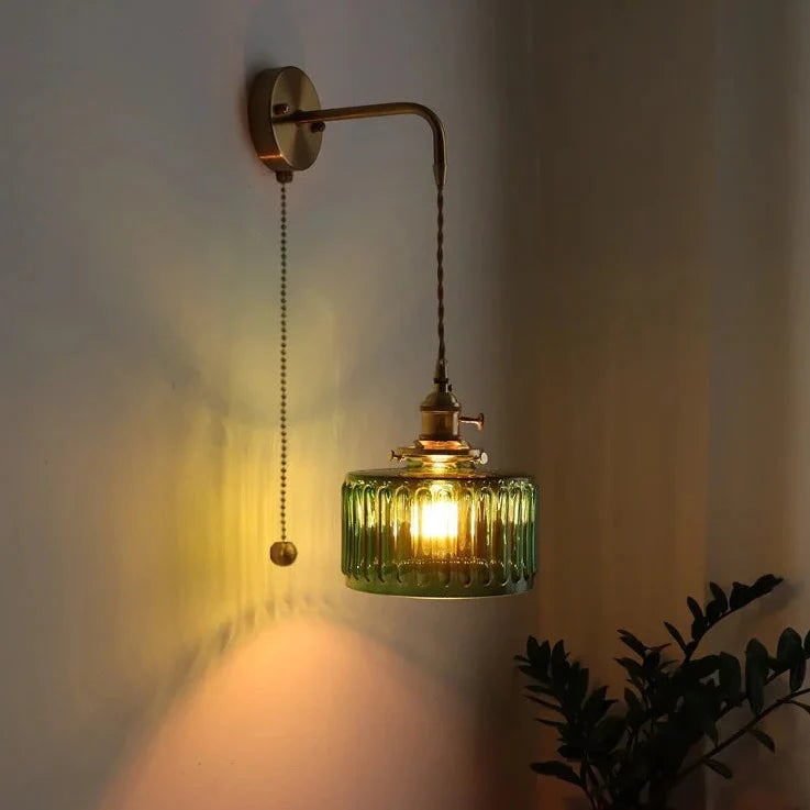 Plug in Wall Sconce with Brass Arm and Green Textured Glass Shade - Image 1