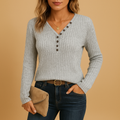 Women’s ribbed V-neck top in grey with button details, ideal for casual wear or layering in cooler seasons.