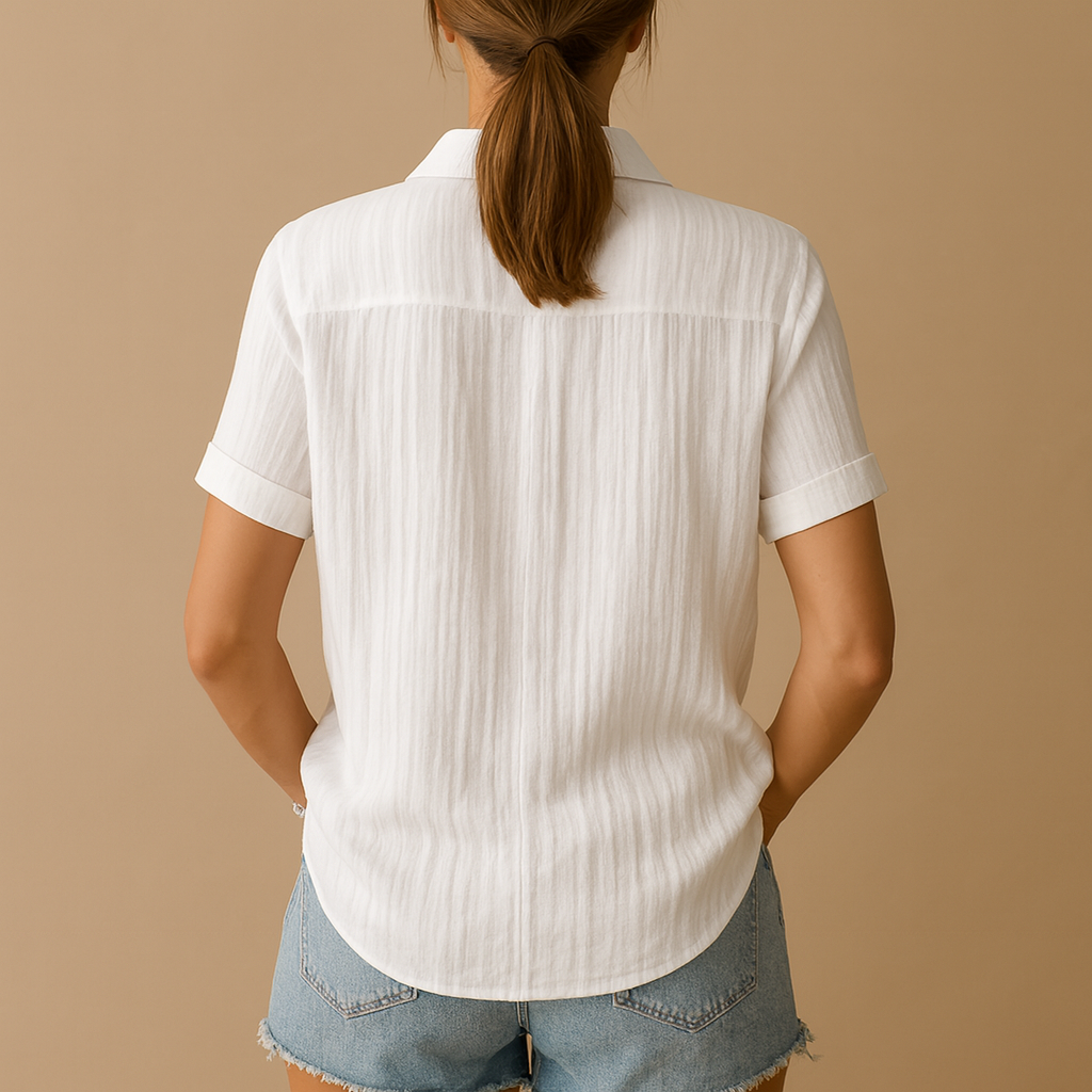 Women’s short-sleeve blouse with relaxed fit and chest pocket in white, ideal for casual and work outfits.