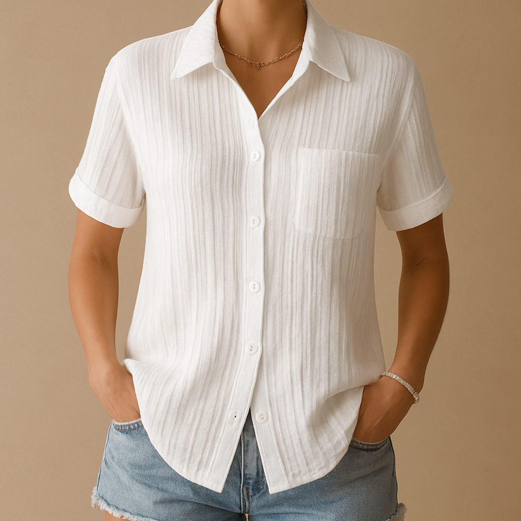 Women’s short-sleeve blouse with relaxed fit and chest pocket in white, ideal for casual and work outfits.
