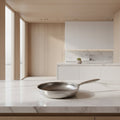 Stainless Steel Frying Pan with Hammered Interior and Induction Compatible Base - Image 1