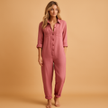 Woman wearing a tailored polo-collar jumpsuit with a fitted waist and tapered legs, ideal for work or stylish daily outfits.