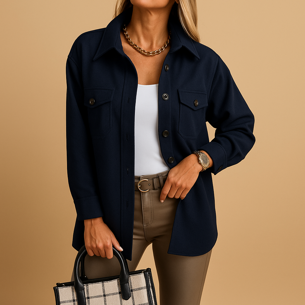 Woman wearing a waterproof tailored jacket with a structured collar, button closure, and pockets, suitable for work and casual outfits.