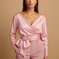 Women’s wrap blouse with adjustable tie waist and long sleeves in pink, perfect for elegant casual and formal looks.