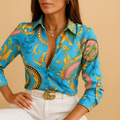 Women’s wrap-neck blouse with a bold print and loose fit, ideal for office wear, evenings out, and stylish daily outfits.